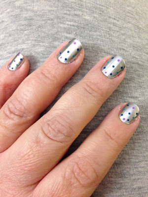 Silver nail polish with multi-colored polkadots